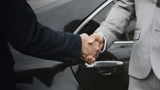 Businessmen greeting